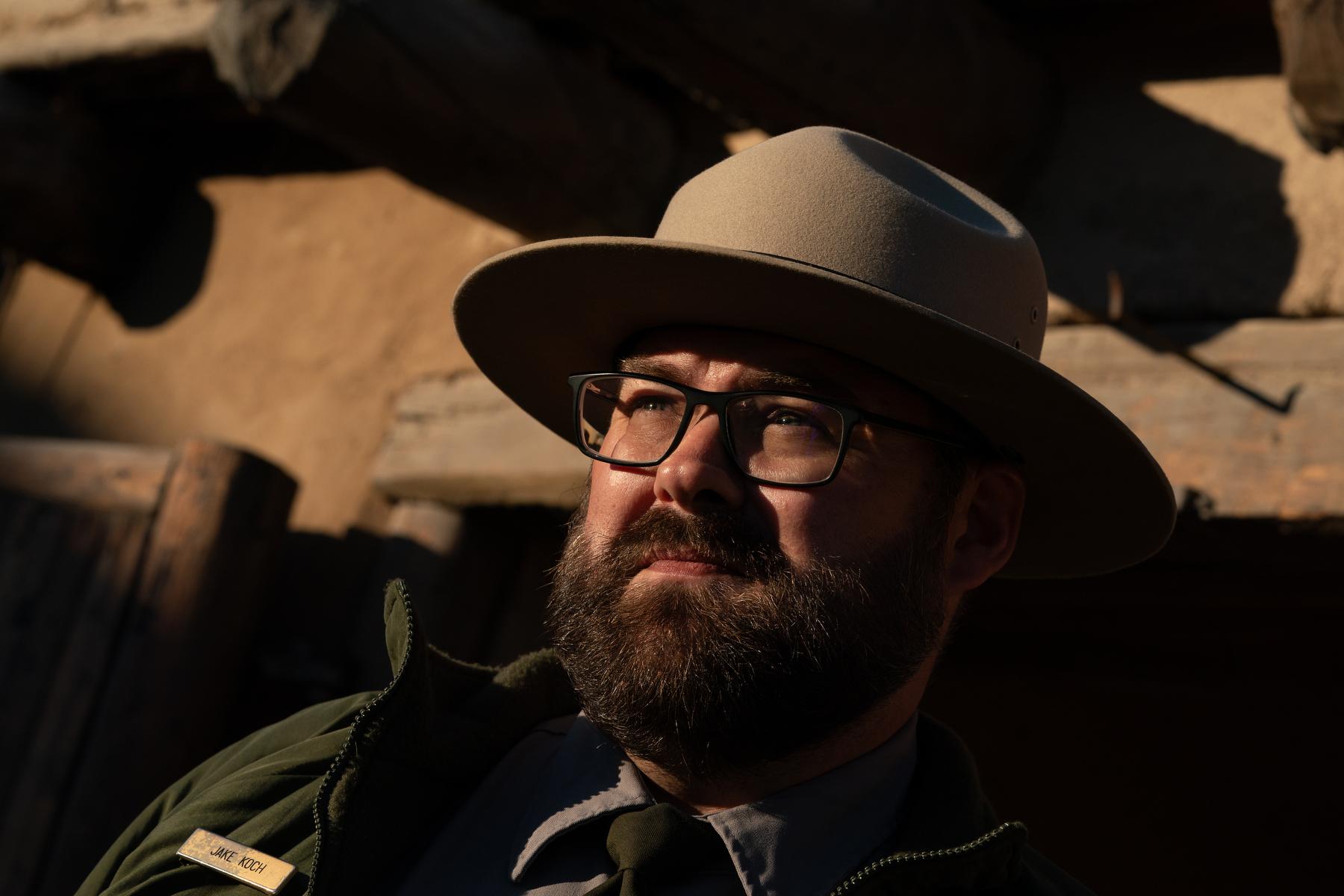 Jake Cook, an interpretative manager at Bent's Old Fort, dressed in park service uniform hat and shirt