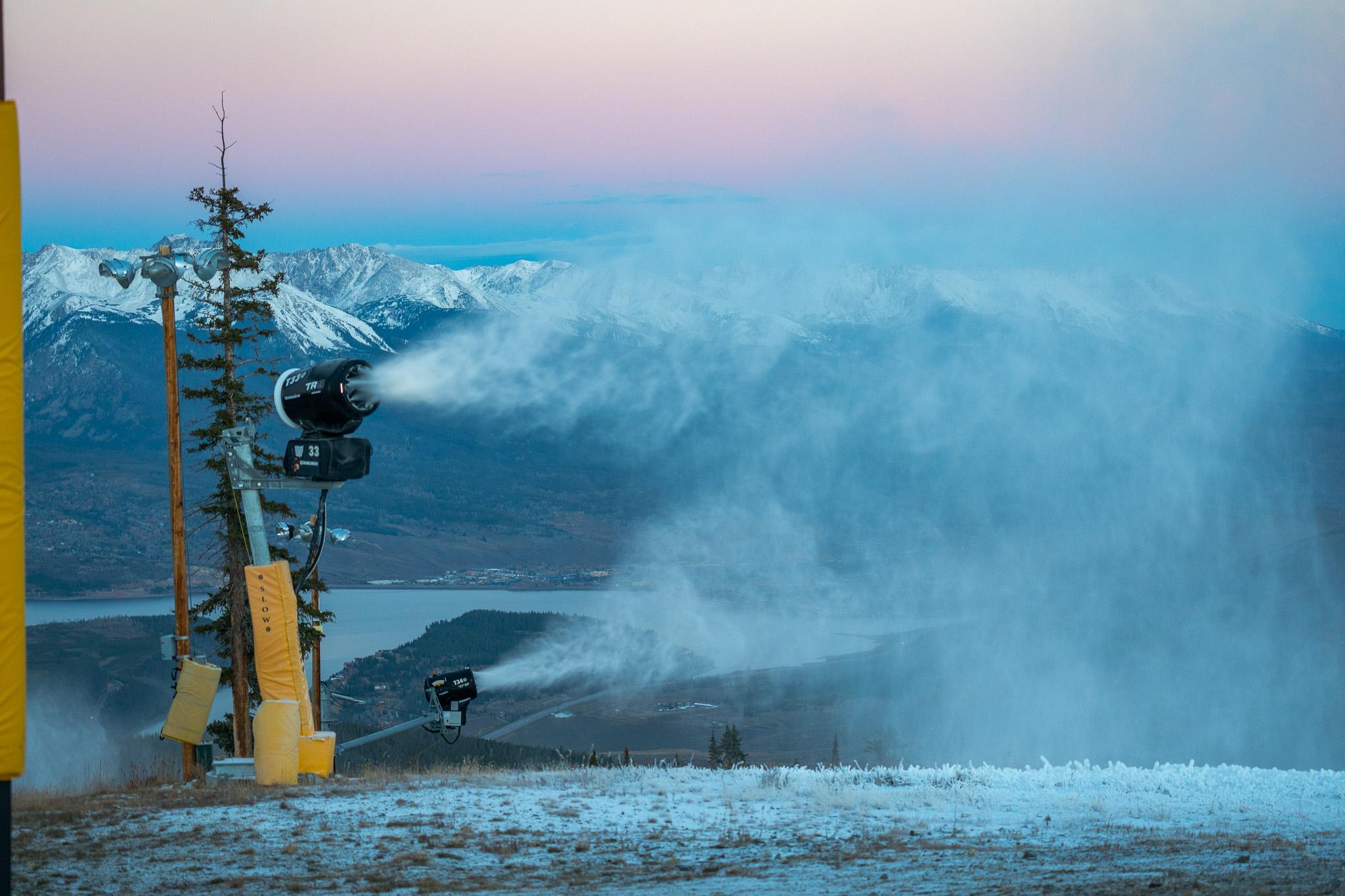 A snowmaking machine sprays snow
