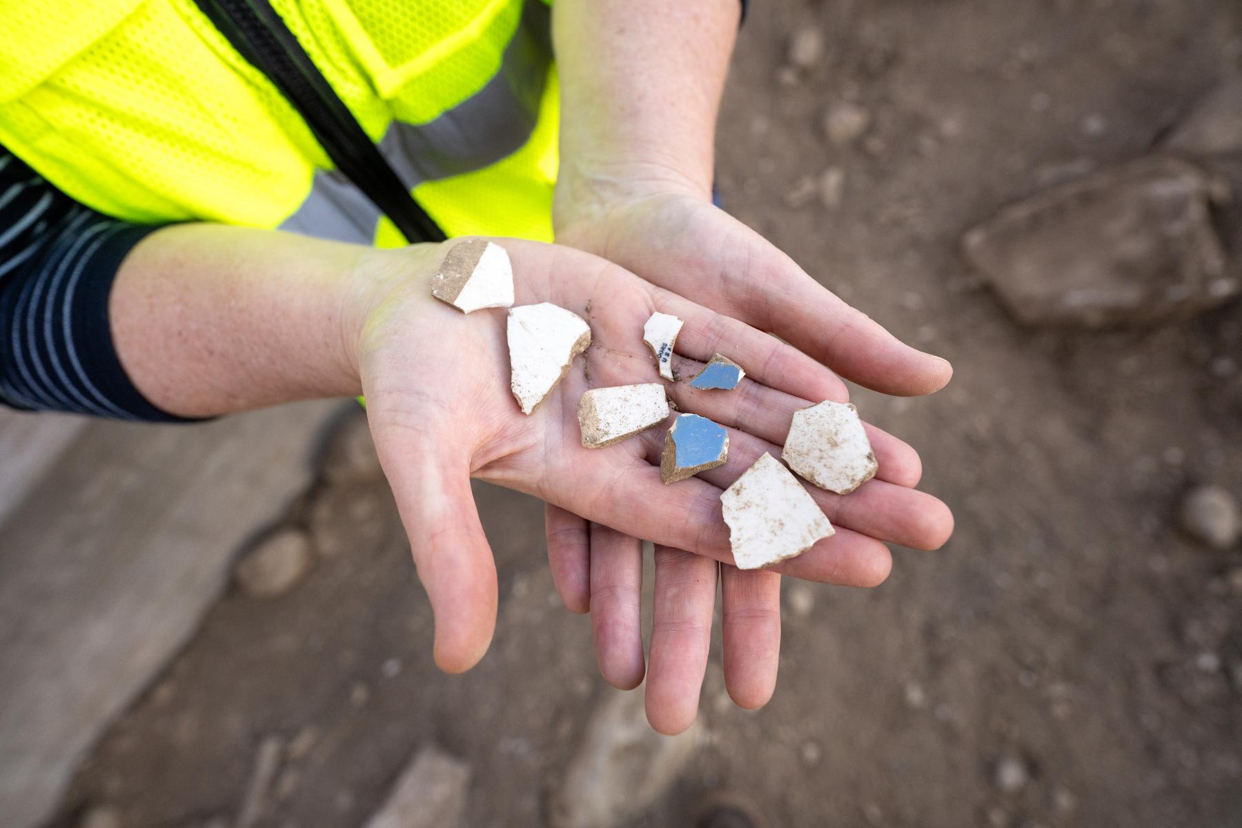 Darden Coors holds pottery shards
