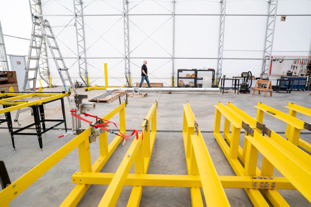 Inside Solar Dynamics' in the company’s massive, tent-covered facility outside Watkins