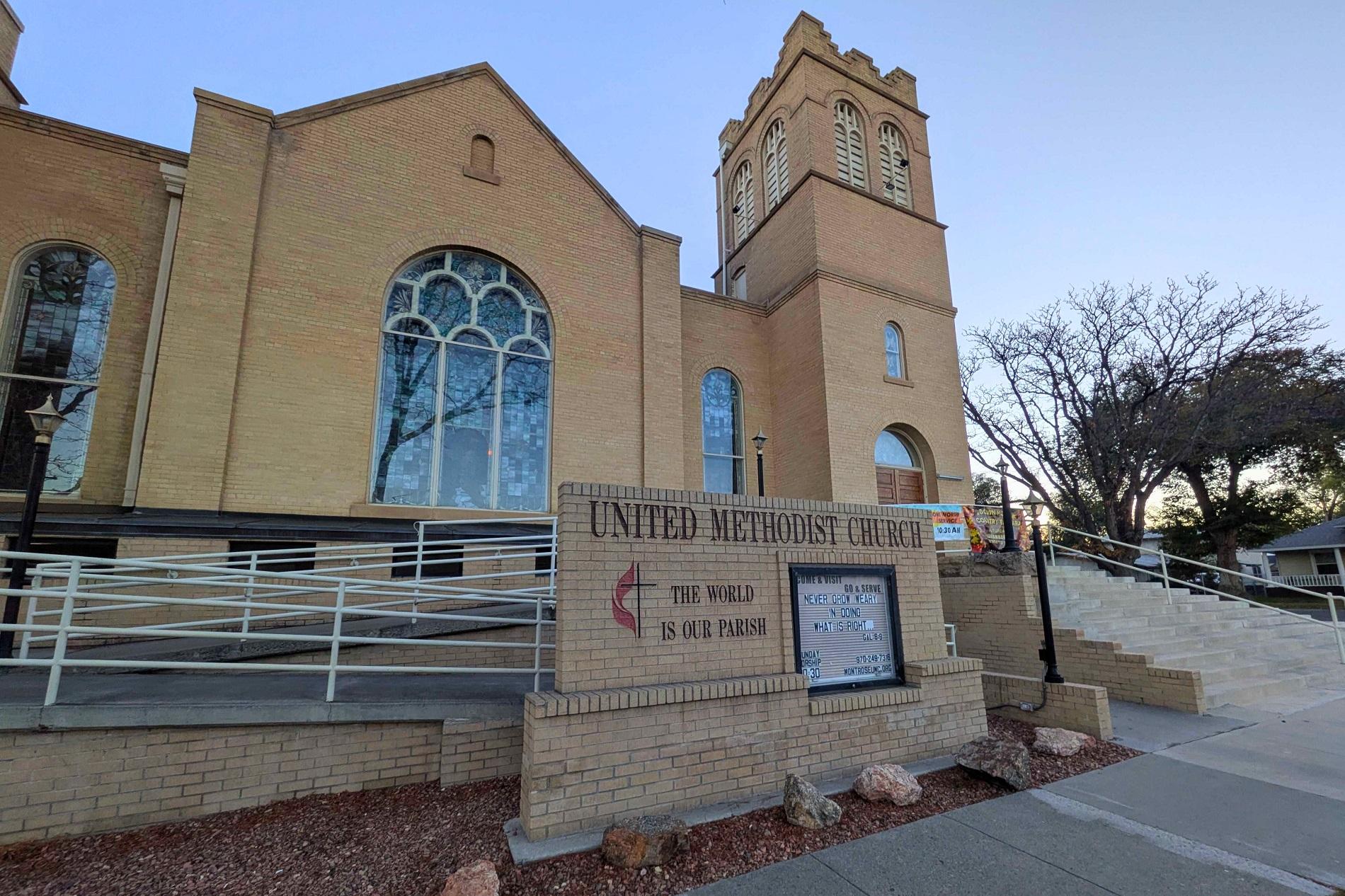 A brick Methodist Church is seen at sunrise in Montrose Colorado