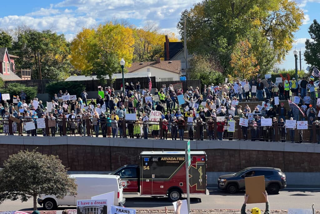 people protesting along a road