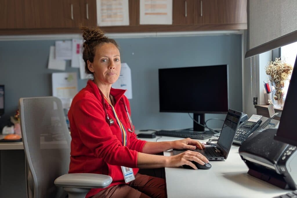 A doctor works at a low-income health clinic in north Denver.