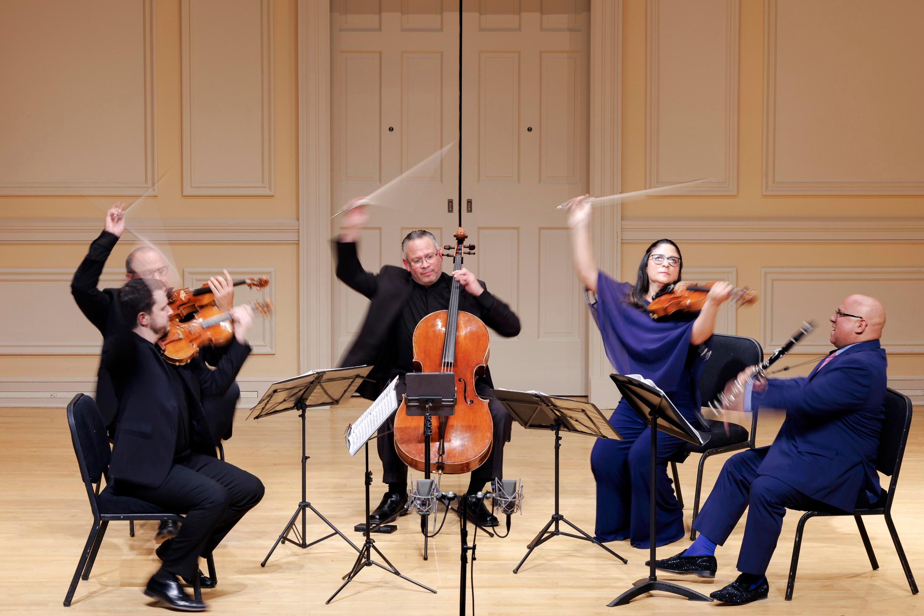 The Dalí Quartet, accompanied by Ricardo Morales on clarinet, performs during the Library of Congress' Stradivari concert in Coolidge Auditorium in 2023. The Library was given a rare set of Stradivarius instruments in 1935.