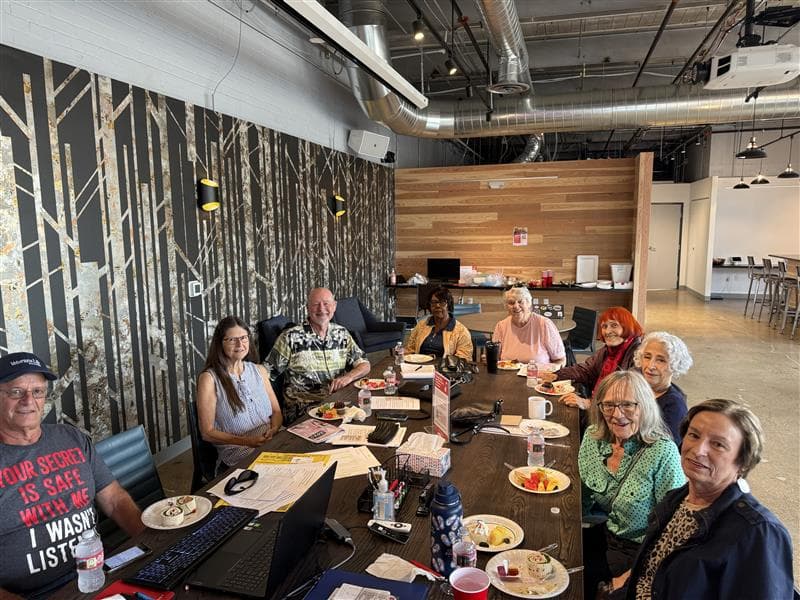 Older Coloradans sit around a table
