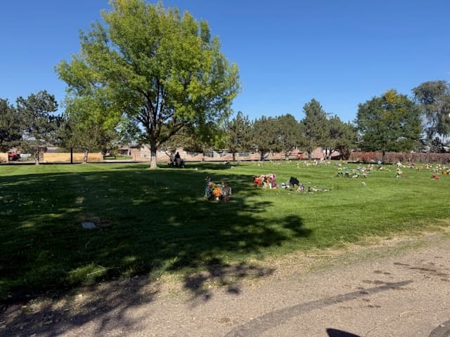 cemetery with trees and flowers