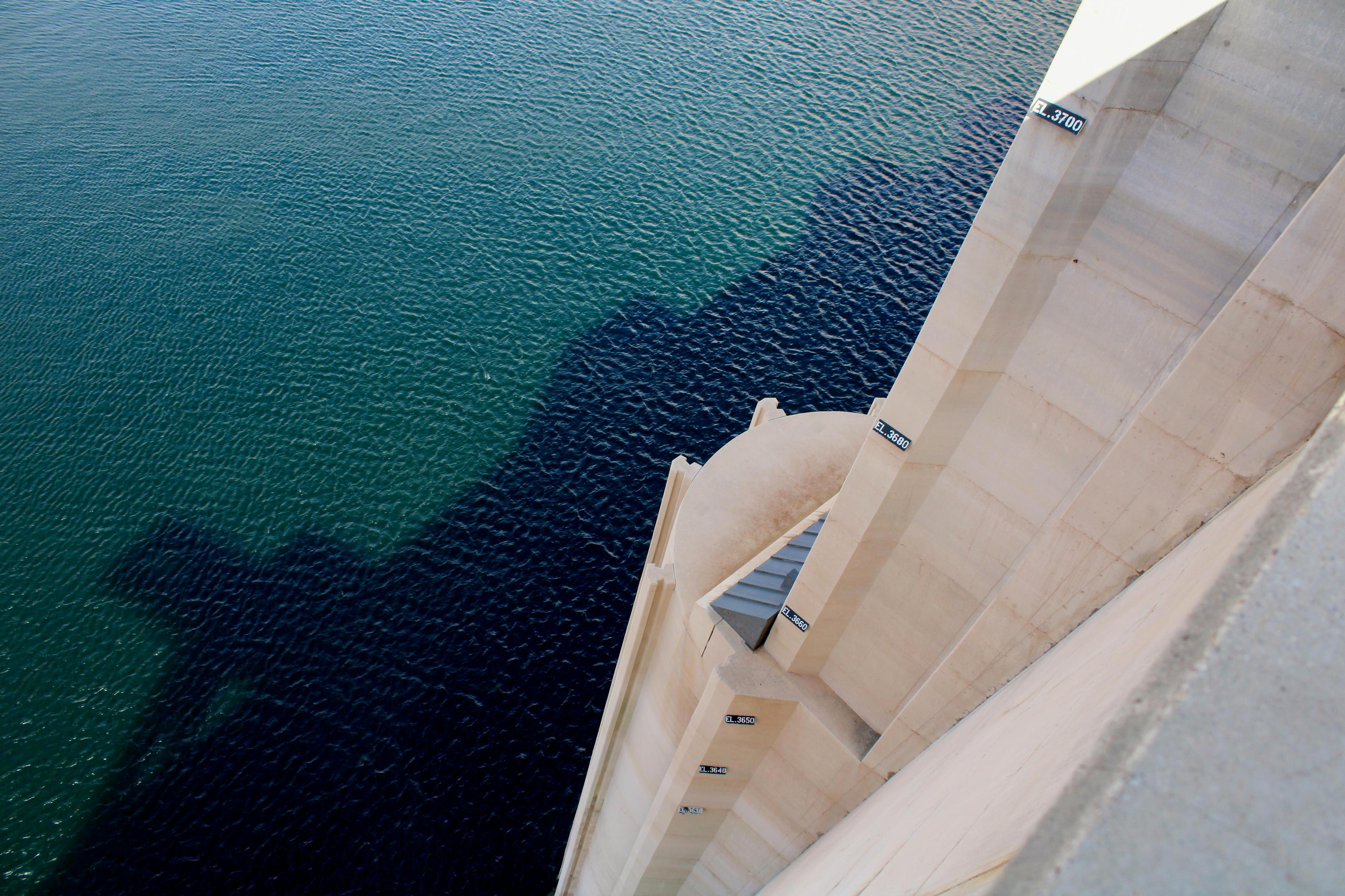 Markers on the side of the dam once tracked the elevation of Lake Powell. With the nation's second-largest reservoir at 24% of its original capacity, water now falls below the lowest marker.