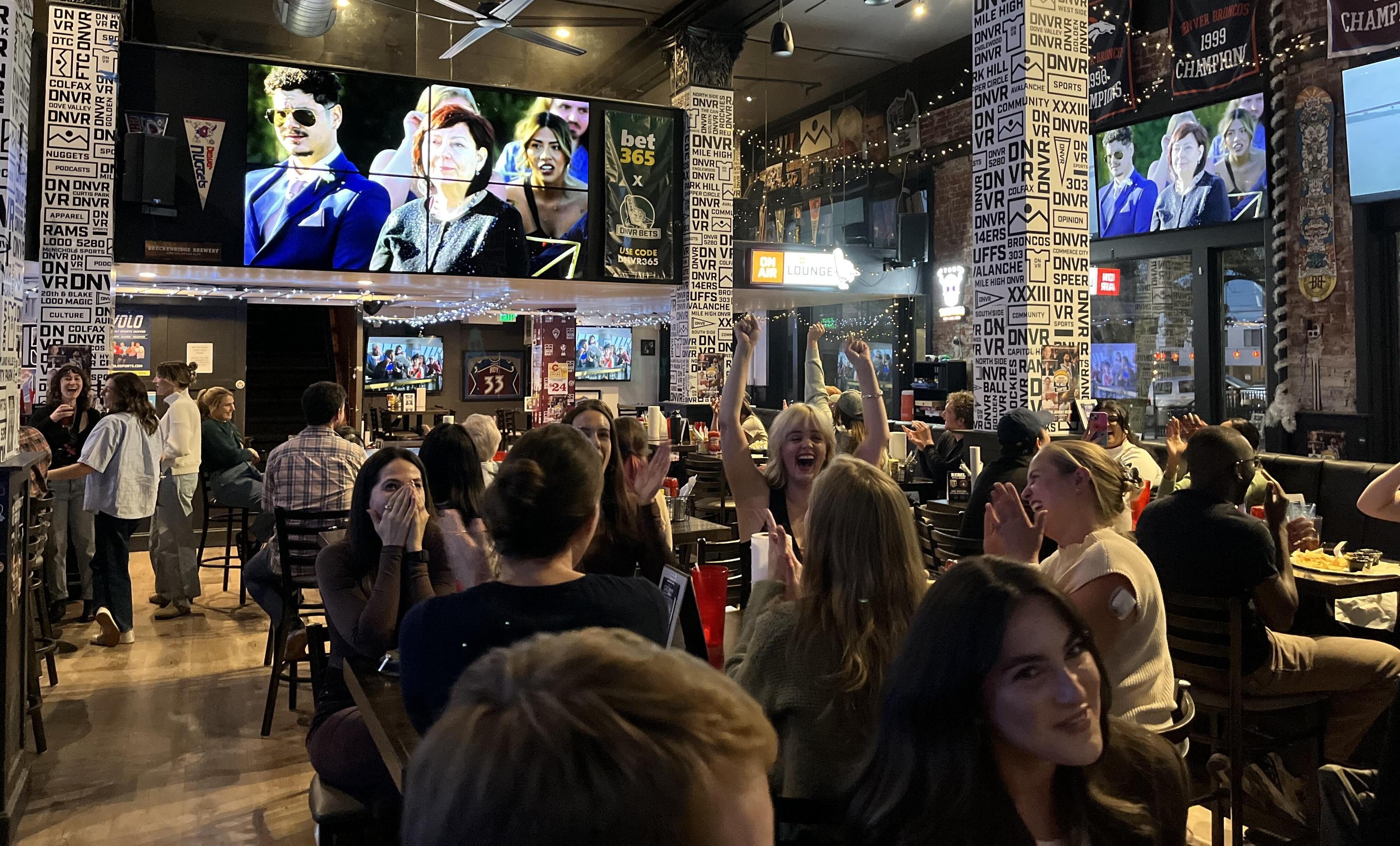Tables full of locals are watching the season finale of hit reality television show Love Is Blind at DNVR, a Denver bar, on Wednesday, October 22, 2025. Bars across the city held watch parties for the show's latest season, which was shot in Denver.