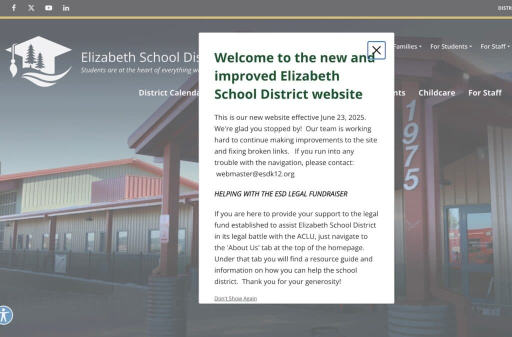 A website is displayed on a screen, featuring a welcome message and information about the new and improved Elizabeth School District website.