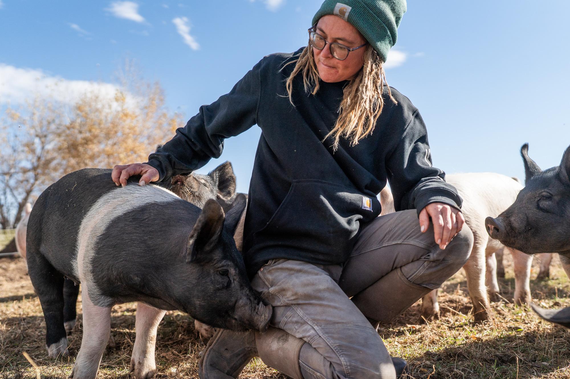 Jodar Farms manager Maggie with some of the pigs they raise