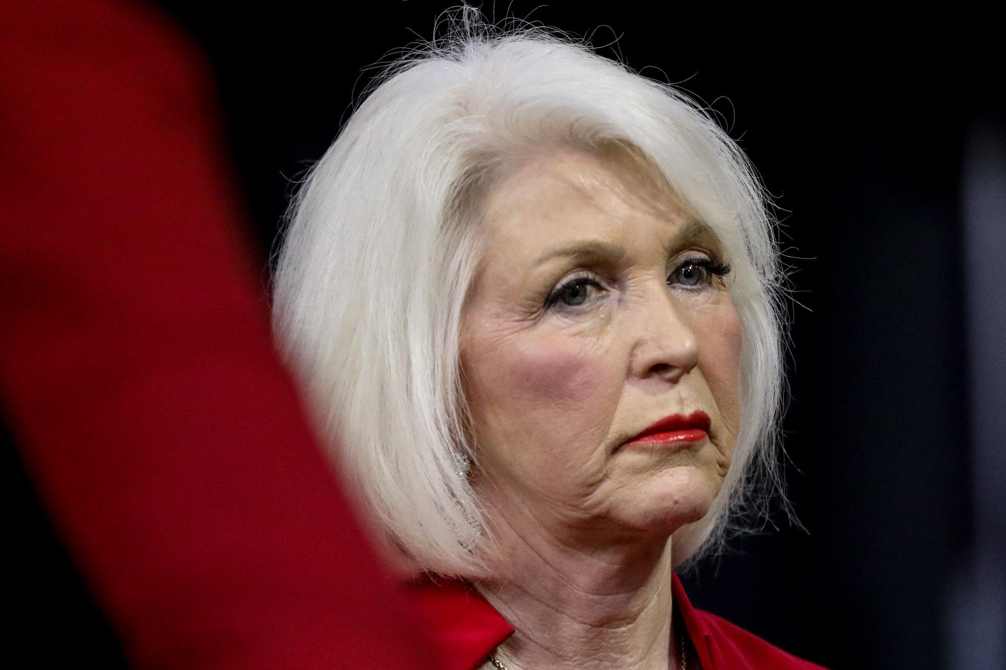 a person with a white haircut as a bob