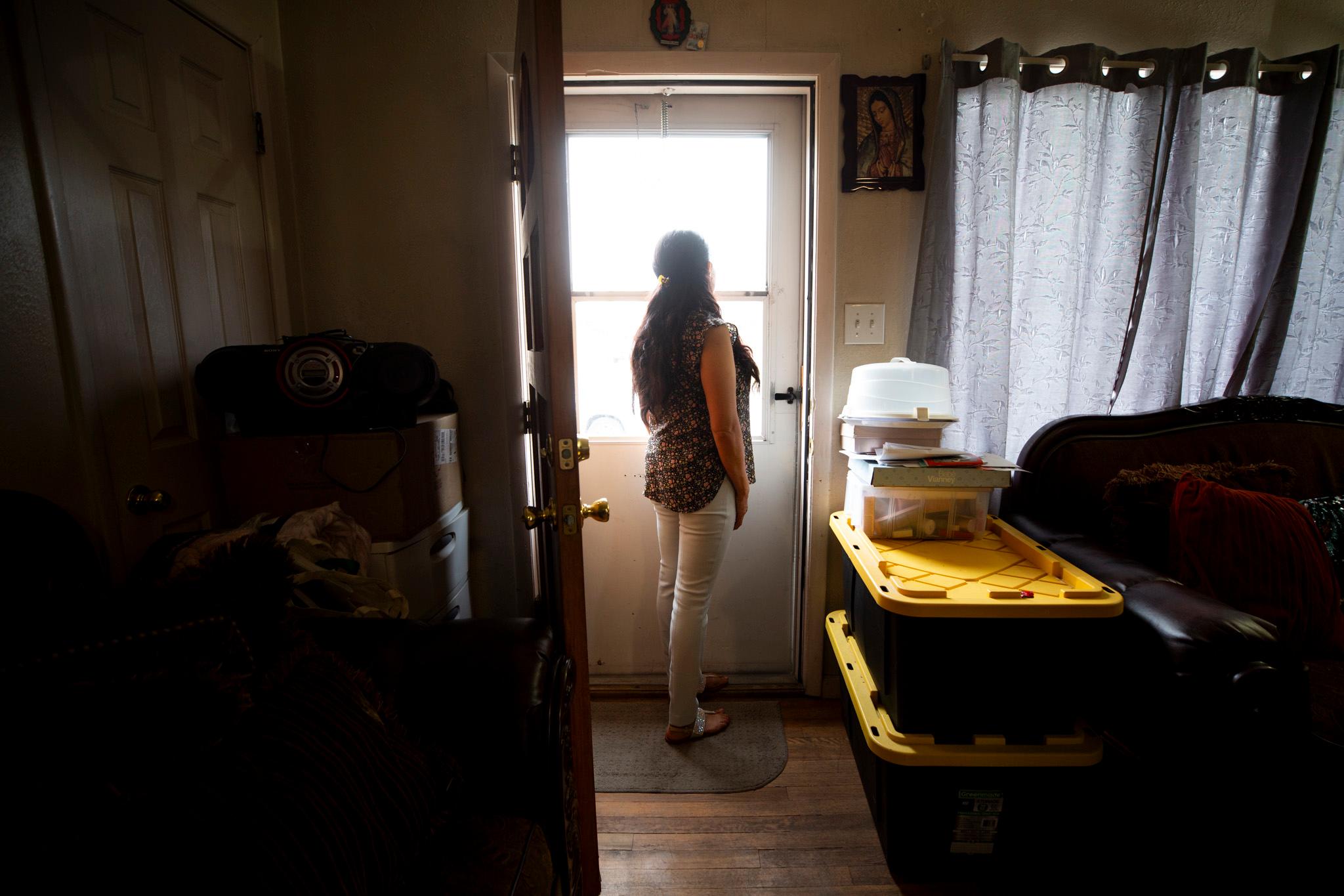 Blanca stands at the door of her Westminster home. Nov. 20, 2025.