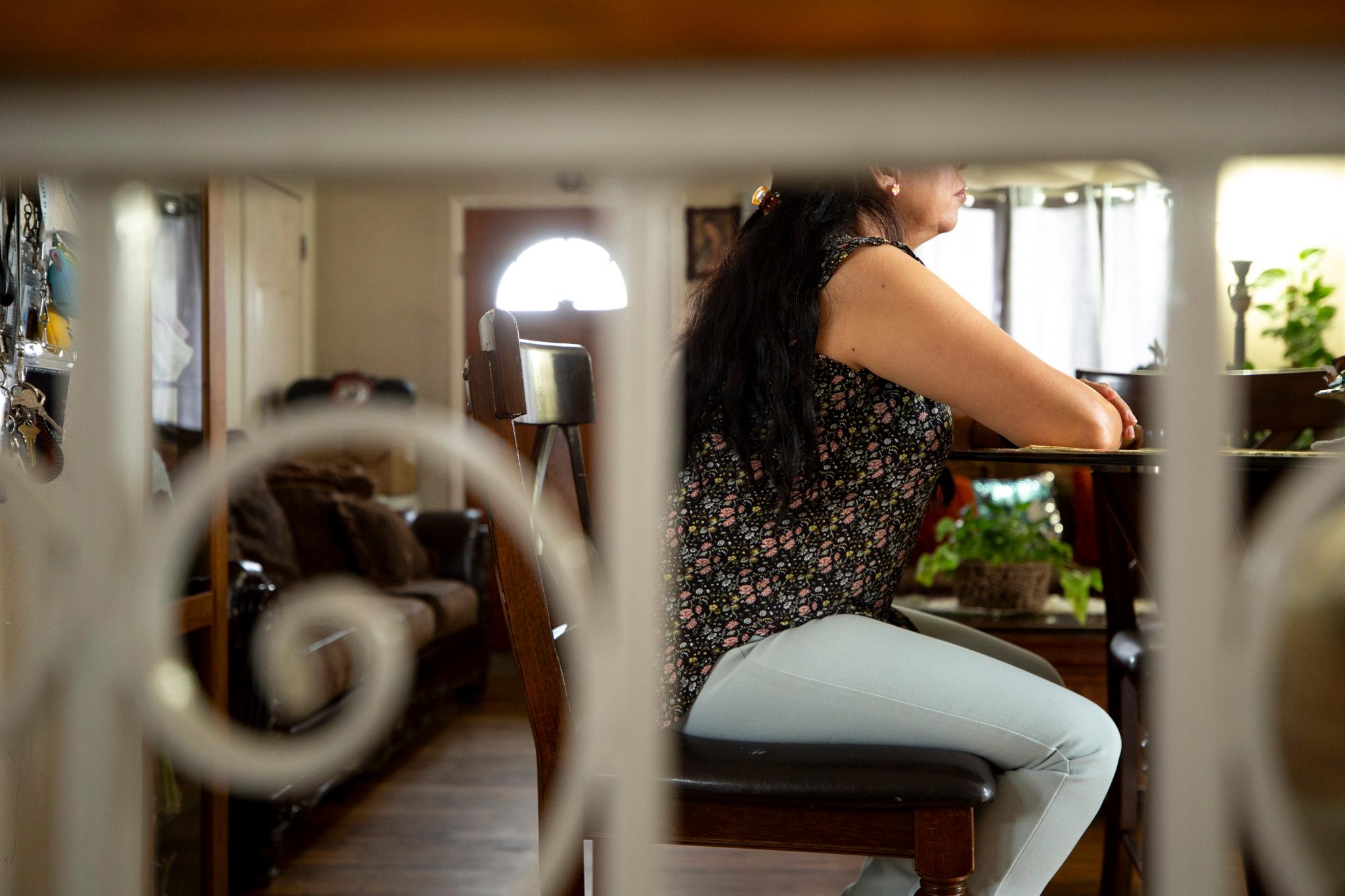 Blanca sits at the kitchen table in her Westminster home. Nov. 20, 2025.