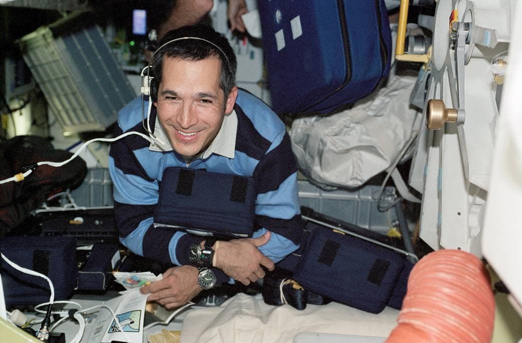 Astronaut John B. Herrington is smiling as he floats on the middeck of the Space Shuttle Endeavour.