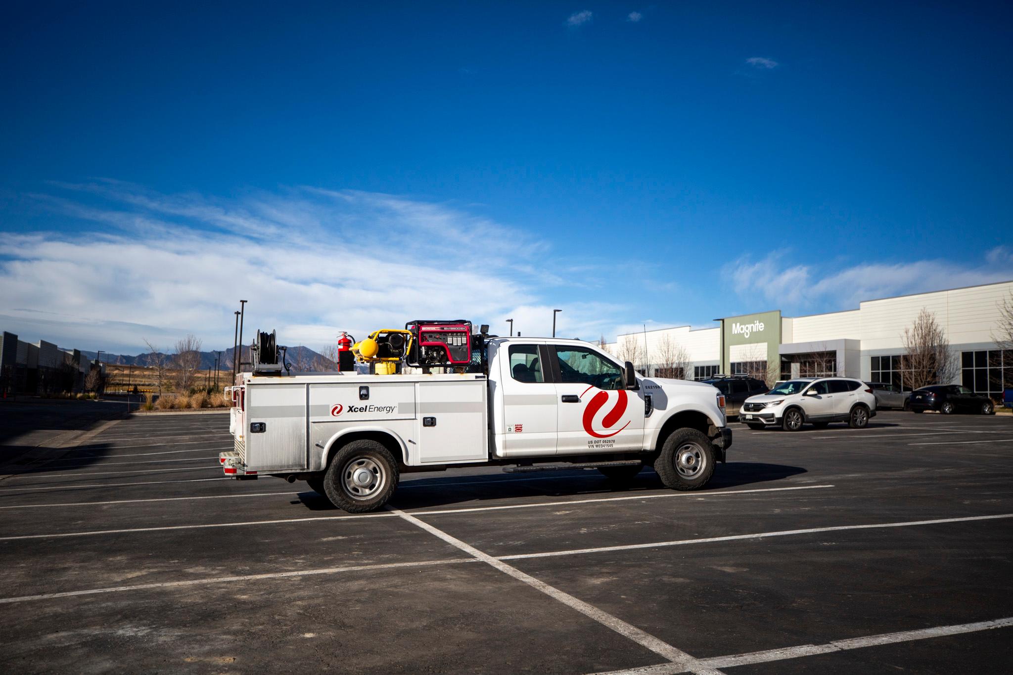 An Xcel Energy truck is parked in Louisville on a windy day. Dec. 17, 2025.