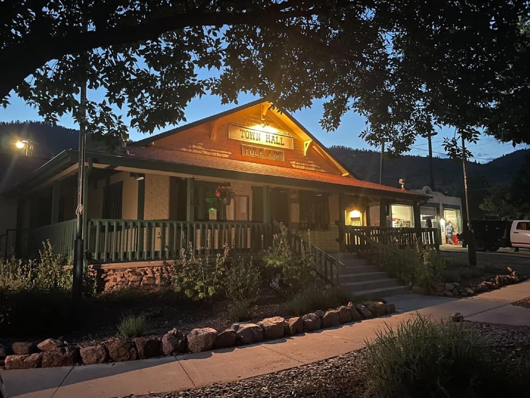 A small rustic building at dusk