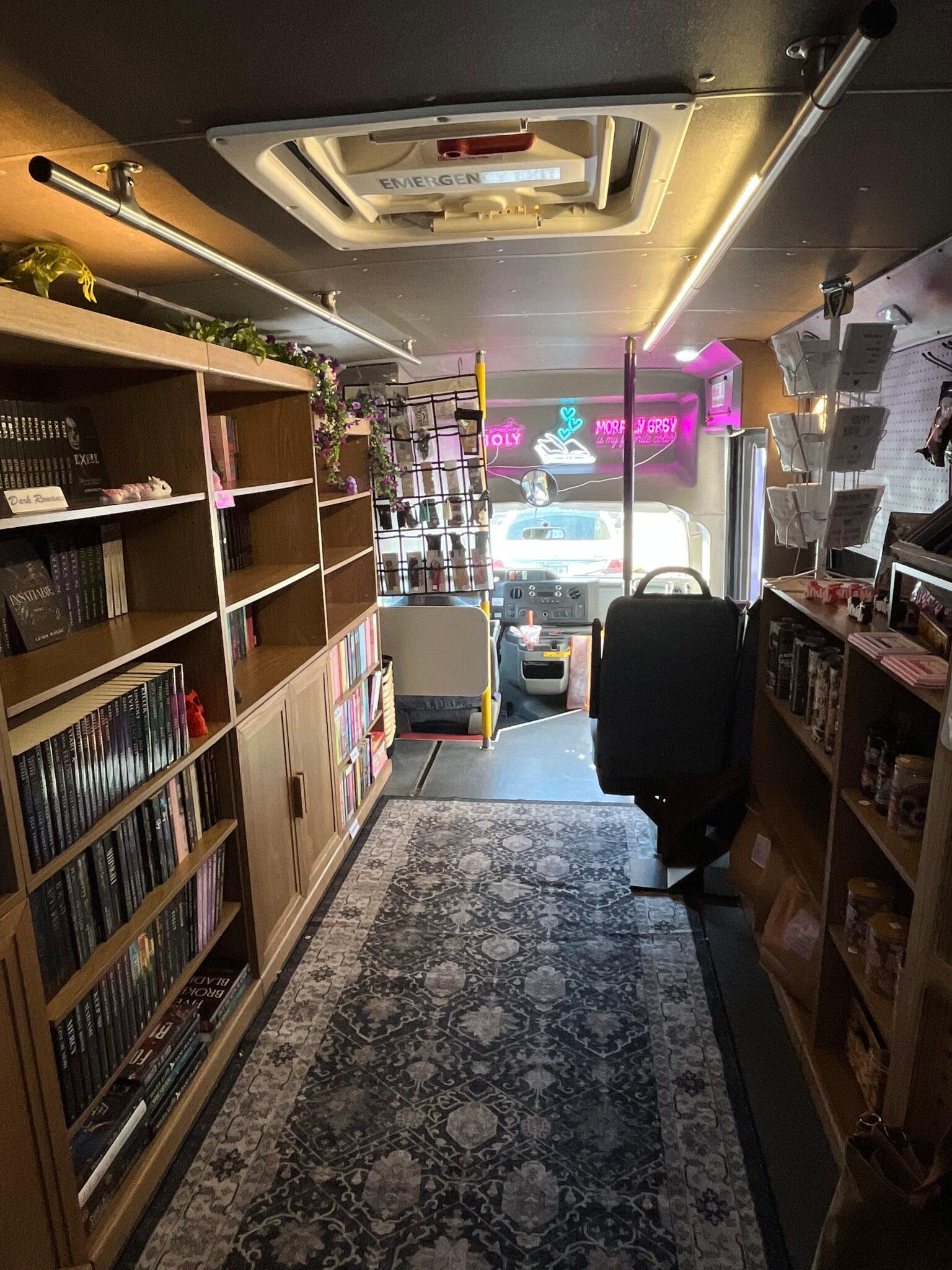 The inside of a bus that has been turned into a mobile bookstore.