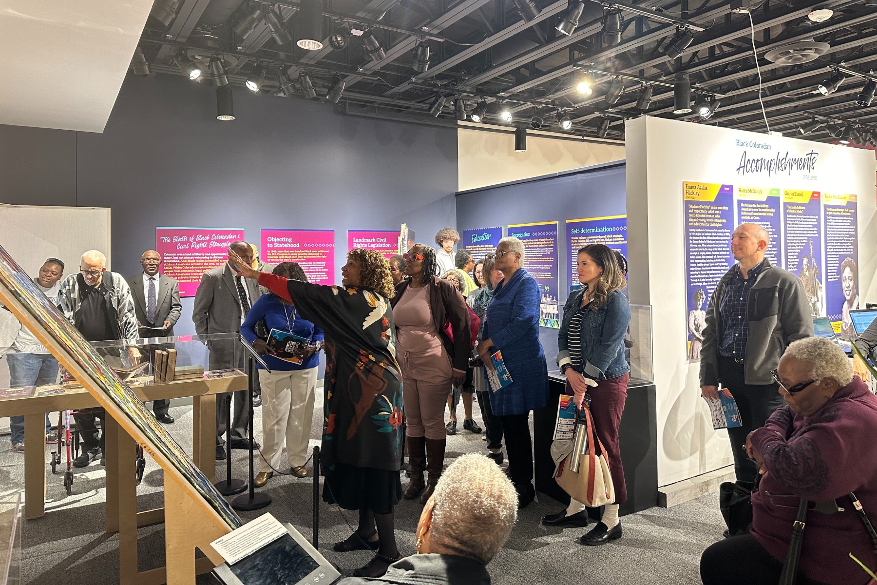 people at exhibit looking at displays