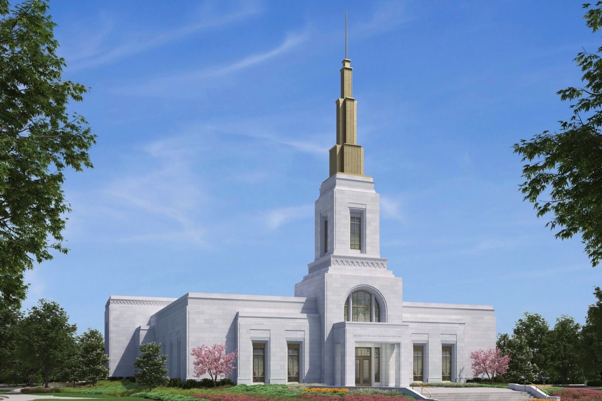 A white LDS temple is shown on a sunny spring day. The building is made of white stone with a golden spire.