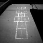 A hopscotch grid near the playground at Denver Child Care Center Inc. in southwest Denver, one of the region's oldest daycares. May 15, 2026.