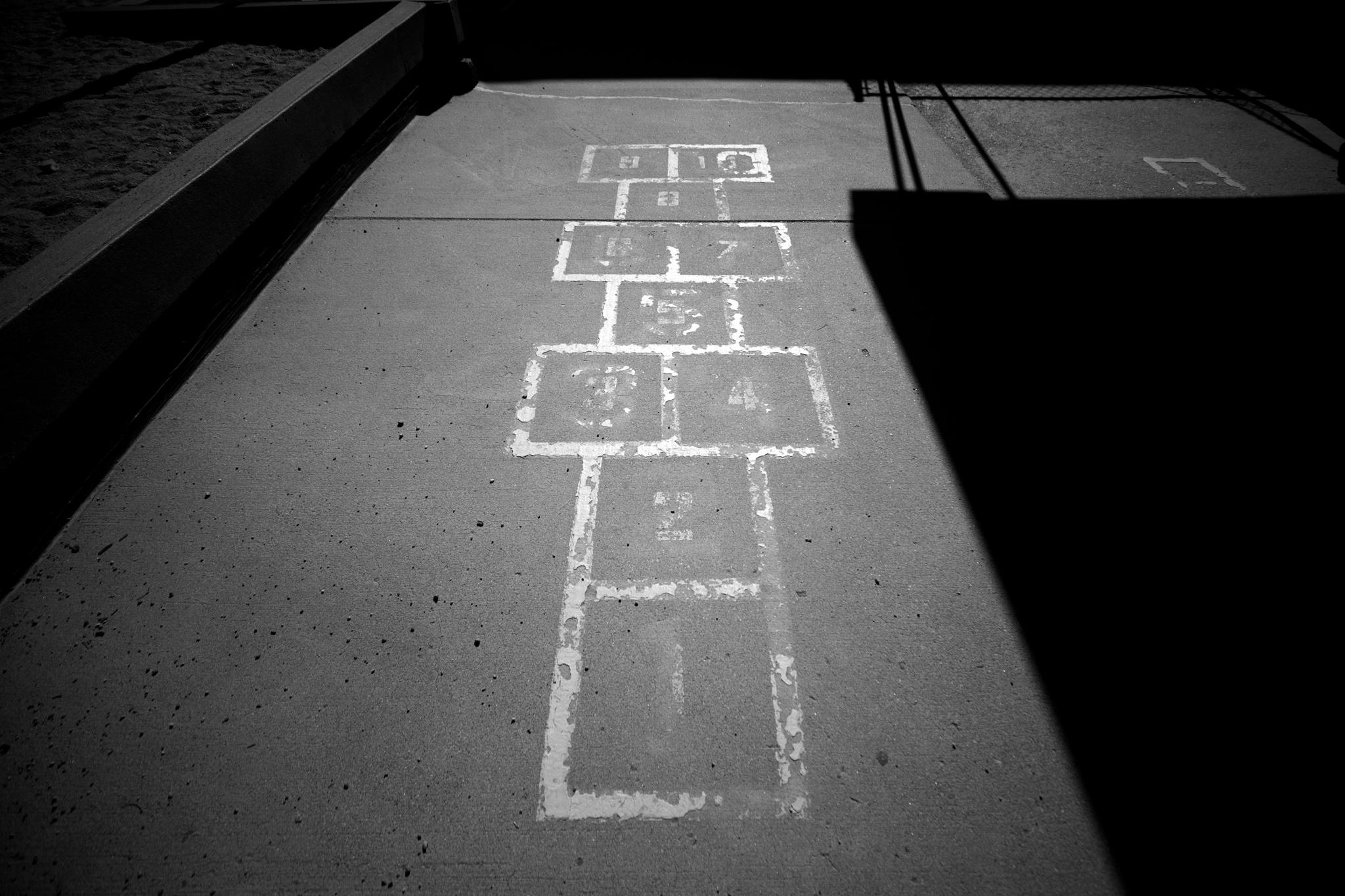 A hopscotch grid near the playground at Denver Child Care Center Inc. in southwest Denver, one of the region's oldest daycares. May 15, 2026.